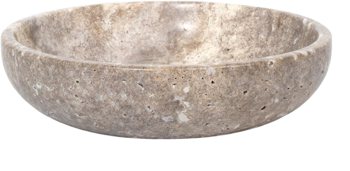Travertine bowl styled on an organic modern kitchen counter