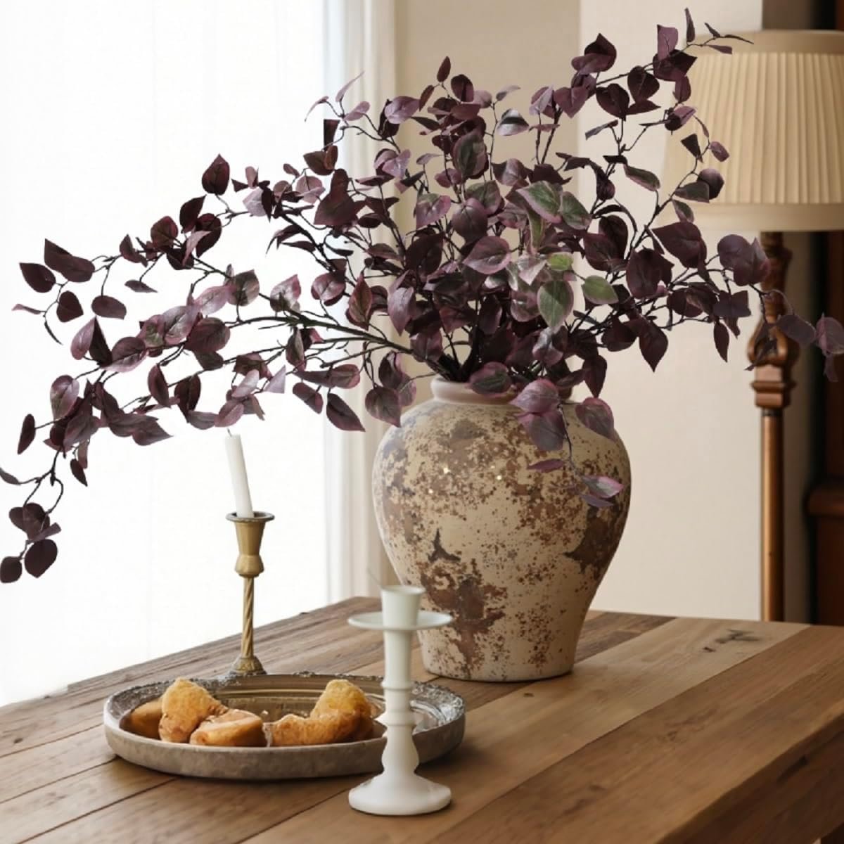 Artificial fall eucalyptus branches in a vase