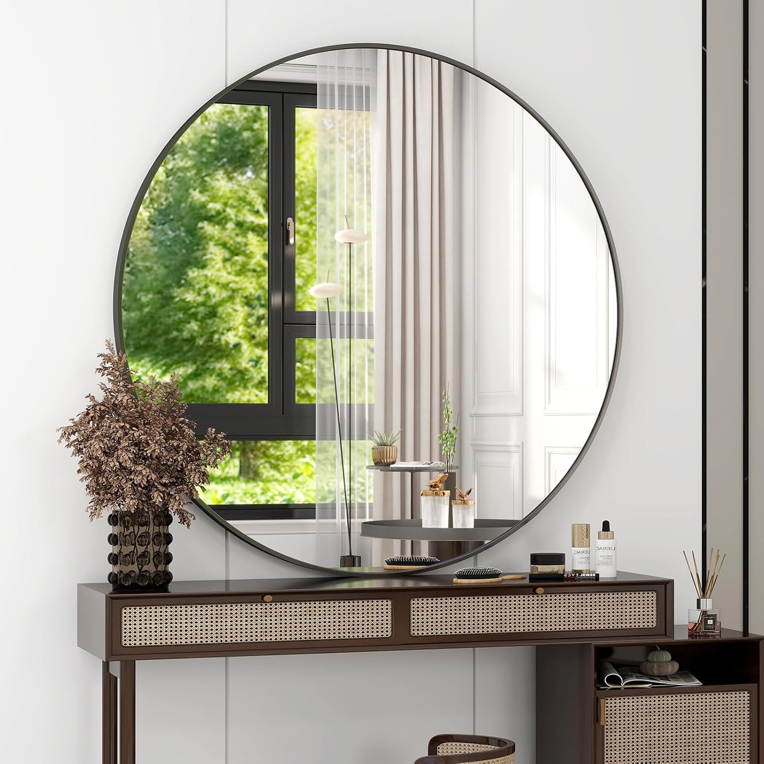42-inch round black wall mirror in a styled entryway console vignette