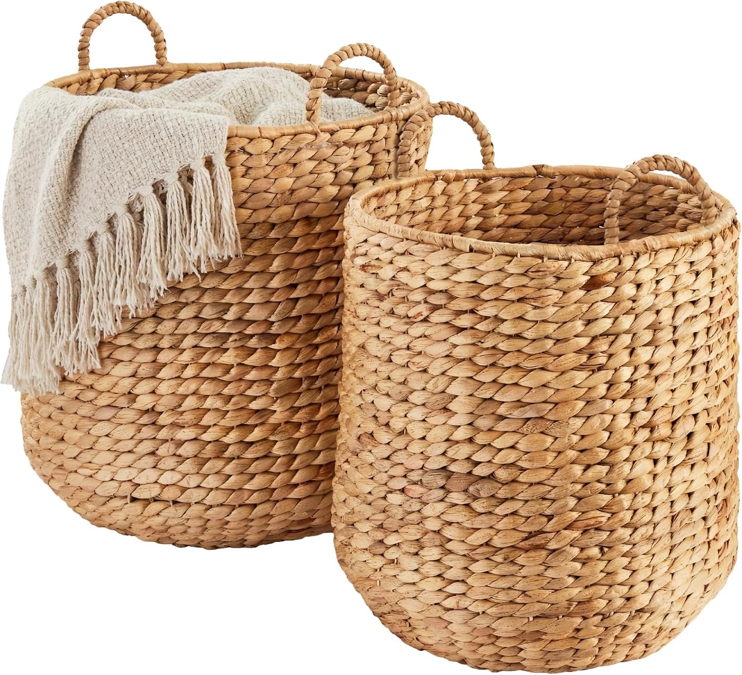 Two-piece round woven nesting storage baskets with a throw blanket